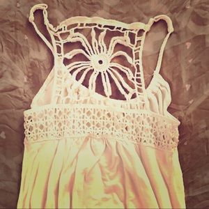 Cute XS white tank with adorable detail.